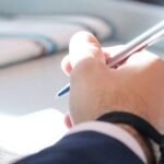 Student writing exam.