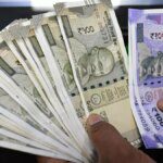 Rupee settles flat at 87.50 against USD after inching close to 88-level in intra-day trade