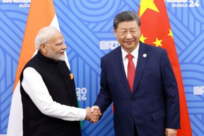 FILE PHOTO: Chinese President Xi Jinping and India Prime Minister Narendra Modi meet on the sidelines of the BRICS summit in Kazan, Russia October 23, 2024.