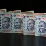 Rupee settles 26 paise higher at 86.55 against US dollar