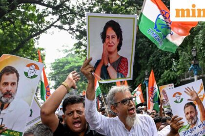 Congress activists carrying posters shout slogans during a protest rally in Kolkata on August 12, 2025, to condemn alleged electoral malpractices and the Special Intensive Revision (SIR) of electoral rolls.