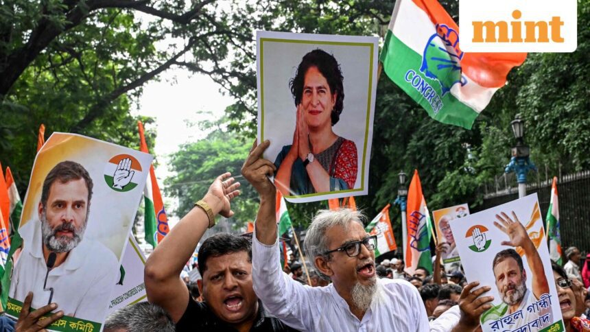 Congress activists carrying posters shout slogans during a protest rally in Kolkata on August 12, 2025, to condemn alleged electoral malpractices and the Special Intensive Revision (SIR) of electoral rolls.