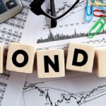 India bond yields inch down on quarter-end buying; RBI policy key