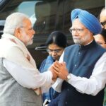 (FILE) Prime Minister Narendra Modi, left, shakes hands with his former counterpart Manmohan Singh. (AP Photo/Manish Swarup)
