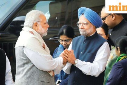 (FILE) Prime Minister Narendra Modi, left, shakes hands with his former counterpart Manmohan Singh. (AP Photo/Manish Swarup)