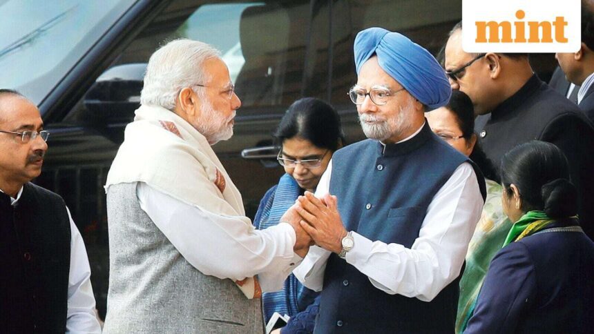 (FILE) Prime Minister Narendra Modi, left, shakes hands with his former counterpart Manmohan Singh. (AP Photo/Manish Swarup)