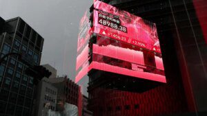 Japan's Nikkei reverses early loss on report of new government stimulus