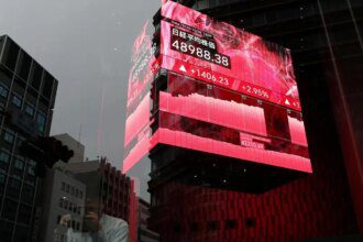 Japan's Nikkei reverses early loss on report of new government stimulus