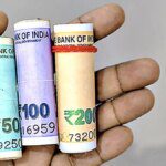 Rupee trades flat in range-bound trade, hovers near all-time lows against US dollar