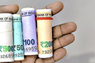 Rupee trades flat in range-bound trade, hovers near all-time lows against US dollar