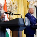 FILE PHOTO: US President Donald Trump listens as Indian Prime Minister Narendra Modi speaks during a joint press conference at the White House in Washington in February 2025.