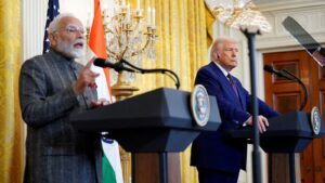 FILE PHOTO: US President Donald Trump listens as Indian Prime Minister Narendra Modi speaks during a joint press conference at the White House in Washington in February 2025.