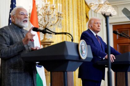 FILE PHOTO: US President Donald Trump listens as Indian Prime Minister Narendra Modi speaks during a joint press conference at the White House in Washington in February 2025.