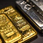 Gold, silver futures drop as Fed's cautious tone pulls down rate cut hopes