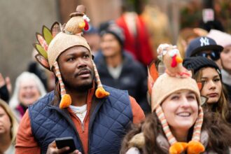 In the US, the Macy’s Thanksgiving Day Parade marches on despite wind gusts