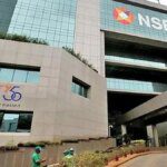 Nifty hovers near record high as banking stocks power rally