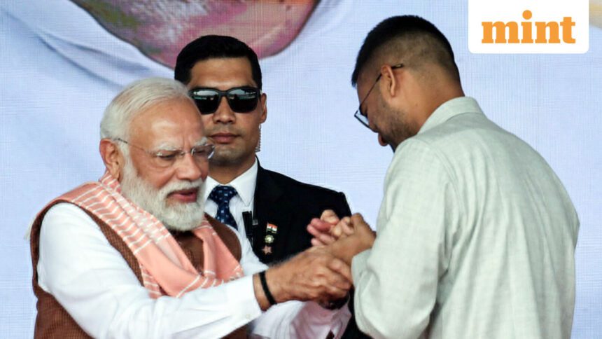 Patna, Nov 20 (ANI): Newly sworn-in Bihar Minister Deepak Prakash greets Prime Minister Narendra Modi during the swearing-in ceremony, in Patna on Thursday. (ANI Photo)