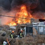 Residents flee as fire devastates Seoul shanty town