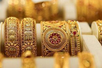 Gold edges down with US-Iran talks, central bank decisions in focus