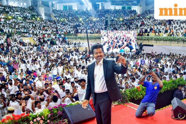 Newly-elected Tamil Nadu Chief Minister and Tamilaga Vettri Kazhagam (TVK) chief C Joseph Vijay takes a selfie with the gathering during his swearing-in ceremony, at Jawaharlal Nehru Stadium, in Chennai, Sunday, May 10, 2026. (PTI Photo)