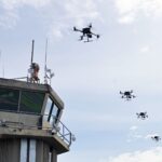 a column of drones in the sky