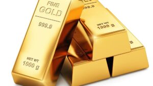 Gold slips on stronger dollar, Fed rate-hike bets