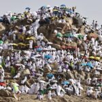 Hajj pilgrims gather at Mount Arafat under scorching desert sun