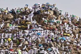 Hajj pilgrims gather at Mount Arafat under scorching desert sun