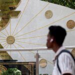 RBI's rupee defence persists after at least $2 bln intervention on Thursday, bankers say