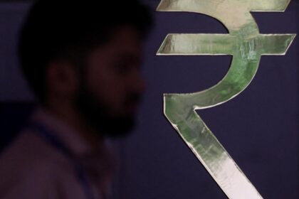 Rupee sinks to a record low