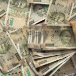 Rupee gains on week, US-Iran jitters spark choppy trading