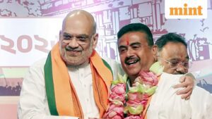 Kolkata, May 08 (ANI): Union Home Minister Amit Shah congratulates BJP leader Suvendu Adhikari after he is elected as the leader of the West Bengal BJP Legislative Party and set to be the new CM of the state, in Kolkata on Friday. (ANI Video Grab)