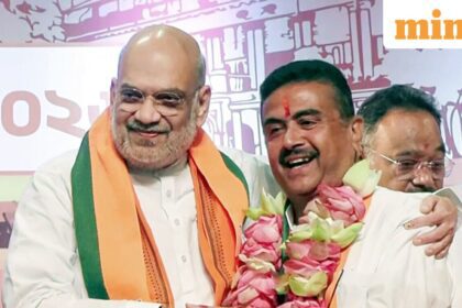 Kolkata, May 08 (ANI): Union Home Minister Amit Shah congratulates BJP leader Suvendu Adhikari after he is elected as the leader of the West Bengal BJP Legislative Party and set to be the new CM of the state, in Kolkata on Friday. (ANI Video Grab)