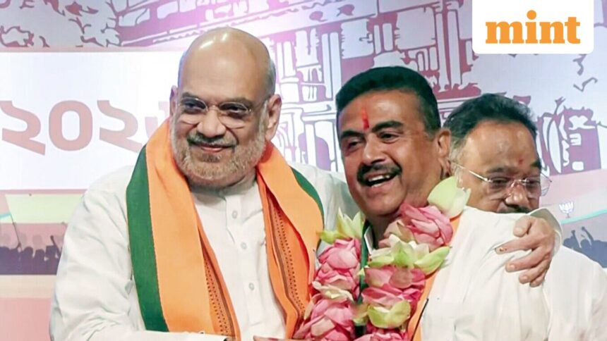 Kolkata, May 08 (ANI): Union Home Minister Amit Shah congratulates BJP leader Suvendu Adhikari after he is elected as the leader of the West Bengal BJP Legislative Party and set to be the new CM of the state, in Kolkata on Friday. (ANI Video Grab)