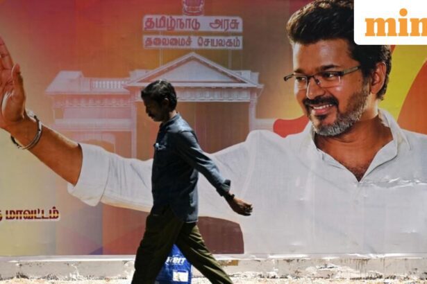 A man walks past a poster praising the victory of actor and Tamilaga Vettri Kazhagam (TVK) party president C. Joseph Vijay in Chennai on May 7, 2026 after the Tamil Nadu assembly election results were announced on May 4 (AFP)