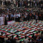 Photos: Thousands in Gaza City join mass funeral for 112 Palestinians