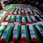 Photos: Gaza holds funeral for 100 Palestinians recovered from rubble