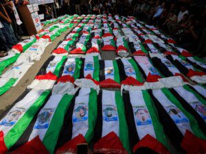 Photos: Gaza holds funeral for 100 Palestinians recovered from rubble