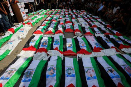 Photos: Gaza holds funeral for 100 Palestinians recovered from rubble
