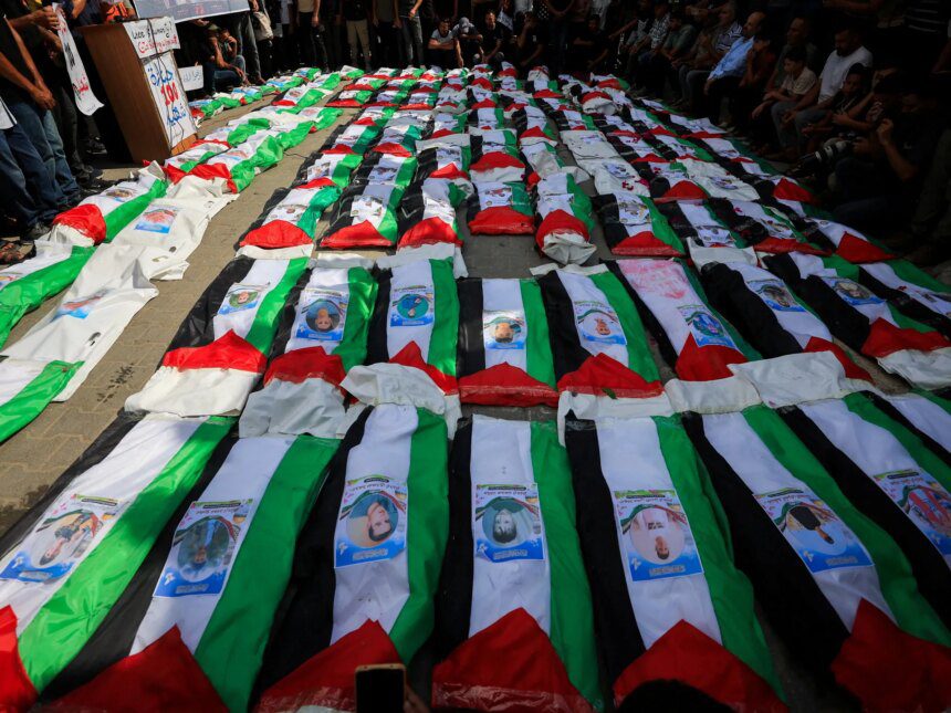 Photos: Gaza holds funeral for 100 Palestinians recovered from rubble