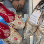 Two styles of silver nagra wedding shoes made by Jabbar Hussain, a fourth-generation craftsman and shopkeeper in Lucknow, India [Aatif Ammad/Al Jazeera]