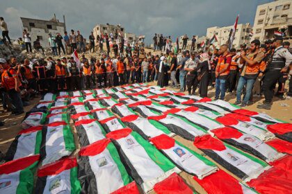 Photos: Palestinians mourn more than 100 loved ones in mass Gaza funeral