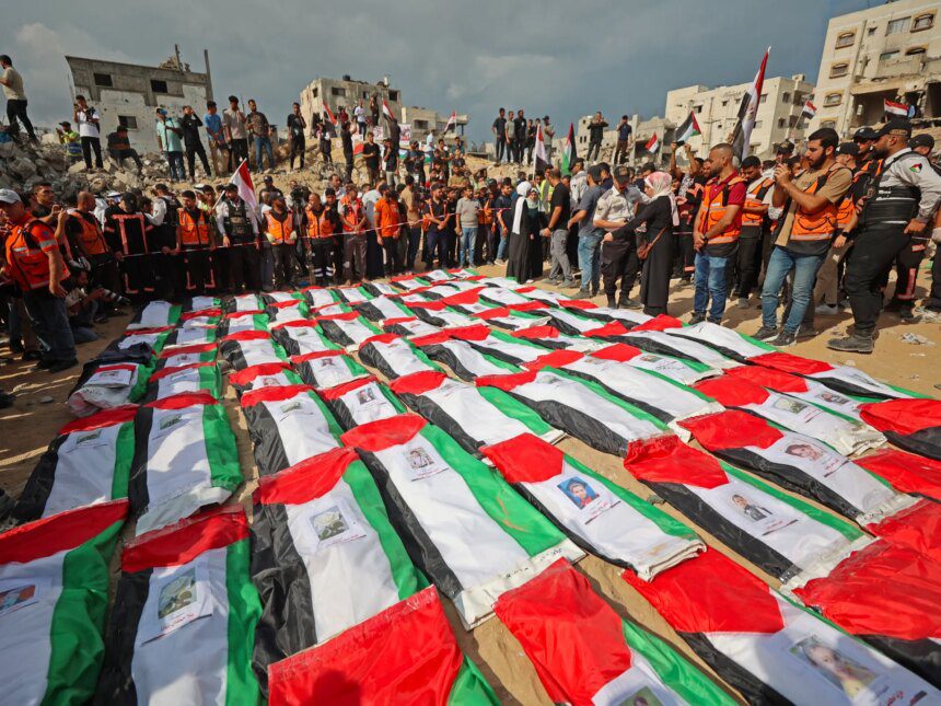 Photos: Palestinians mourn more than 100 loved ones in mass Gaza funeral